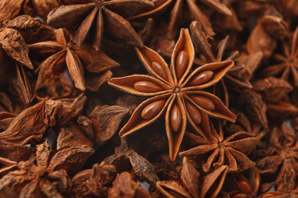 Anise stars spice closeup, abstract aromatic background Abstract aniseed aromatic background. Anise stars condiment close up, panorama anise stock pictures, royalty-free photos & images