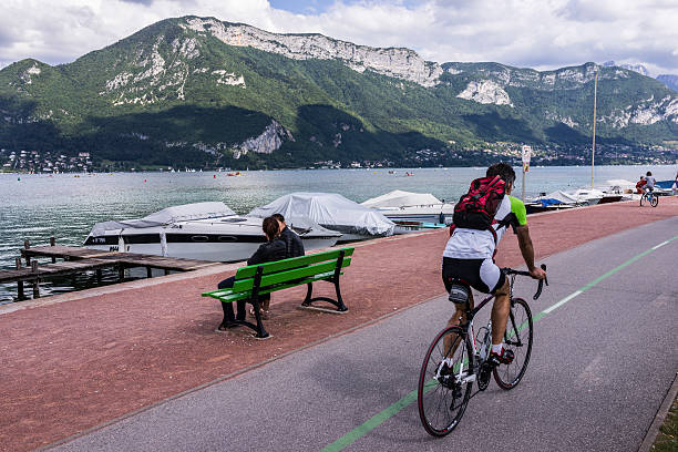 Annecy, France. Tourists on the bike path around the lake stock photo