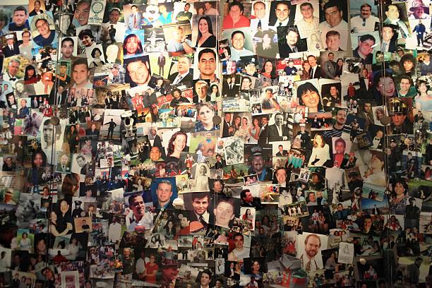 9/11 anniversary "New York, USA - December, 07 2009: Close-up of Twin Towers victims, photo wall at World Trade Center Museum." september 11 2001 attacks stock pictures, royalty-free photos & images