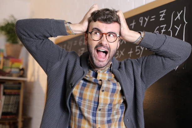 Annoyed teacher with extreme frustration stock photo