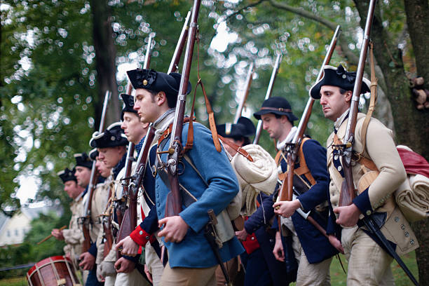 Annual Historic Revolutionary Germantown Festival, Northwest Philadelphia, PA Philadelphia, PA, USA - October 3, 2015; Revolution War era Re-enactors portraying American Militiamen, under Gen. Washington, are seen taking part in the annual Battle of Germantown re-enactment, part of the Revolutionary Germantown Festival, held on the grounds of Cliveden and Upsala, in Northwest Philadelphia, Pennsylvania. (photo by Bastiaan Slabbers) militia stock pictures, royalty-free photos & images