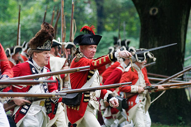 Annual Historic Revolutionary Germantown Festival, Northwest Philadelphia, PA Philadelphia, PA, USA - October 3, 2015; Scene of the reenactment of the  Battle of Germantown, at the grounds of Cliveden in NorthWest section of Philadelphia, Pennsylvania. During the event American Revolutionary War era re-enactors are seen portraying American Militiamen and British 'Redcoats' as they play out the events of October 4, 1777, during the Annual revolutionary Germantown Festival, held on the historic battlegrounds at Chew House. (photo by Bastiaan Slabbers) militia stock pictures, royalty-free photos & images