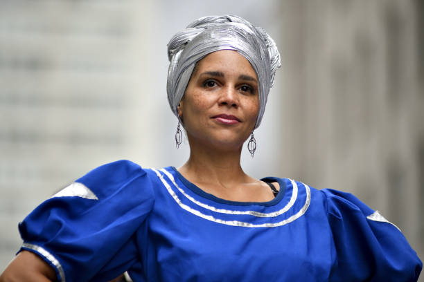 Philadelphia, PA, USA - June 23, 2018; Female participant in traditional attire looks ahead, standing on a float during the annual Juneteenth parade in Center City Philadelphia, PA, on June 23, 2018. The Juneteenth Independence Day or Freedom Day commemorates the announcement of abolition of slavery on June 19, 1865.