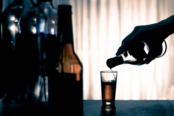 Anonymous alcohol addiction, depression. Alcoholism concept stock photo