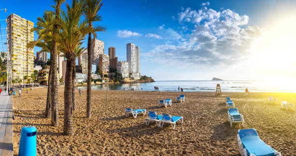 anoramic seascape view of summer resort with beach(Playa de Llevant) and famous skyscrapers. Costa Blanca. City of Benidorm, Alicante, Valencia, Spain. anoramic seascape view of summer resort with beach(Playa de Llevant) and famous skyscrapers. Costa Blanca. City of Benidorm, Alicante, Valencia, Spain. alicante province stock pictures, royalty-free photos & images