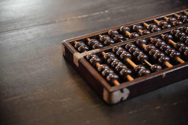 Antique abacus on a desk Antique abacus on a desk abacus stock pictures, royalty-free photos & images