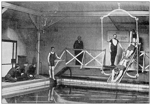Antique black and white photograph: Blind students learning to swim