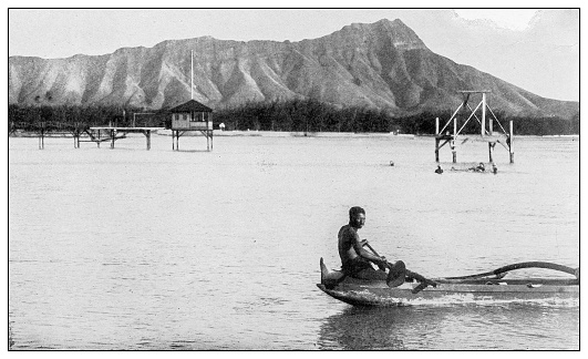 Antique black and white photograph of people from islands in the Caribbean and in the Pacific Ocean; Cuba, Hawaii, Philippines and others: Canoe, Hawaii