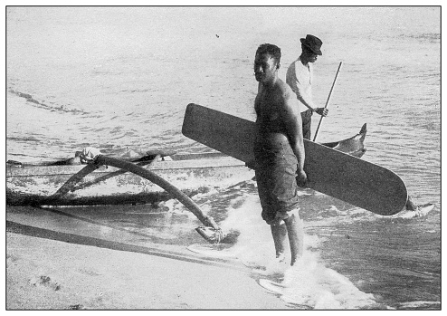 Antique black and white photograph of people from islands in the Caribbean and in the Pacific Ocean; Cuba, Hawaii, Philippines and others: Surf board, Hawaii, 1898