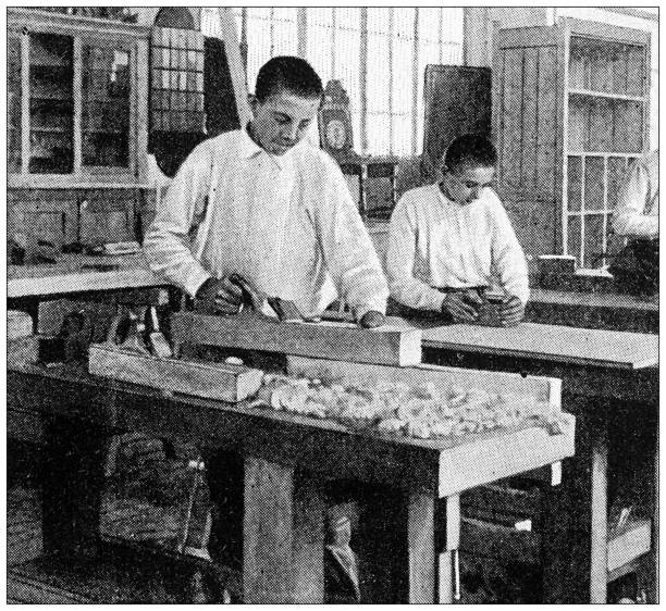 Antique black and white photograph: Wood working class Antique black and white photograph: Wood working class carpenter photos stock illustrations