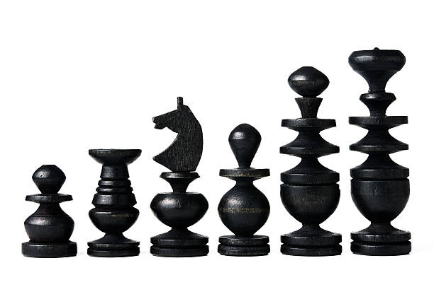 Antique chess pieces - black stock photo