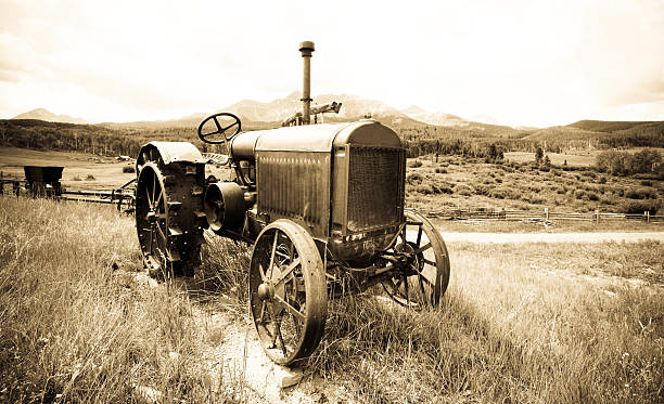 Antique Farm Tractor Vintage old tractor in the high Colorado Rocky Mountains agricultural equipment photos stock pictures, royalty-free photos & images