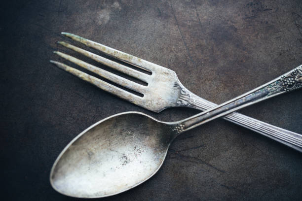 Antique Utensils Spoon and fork. Silverware. chiaroscuro stock pictures, royalty-free photos & images