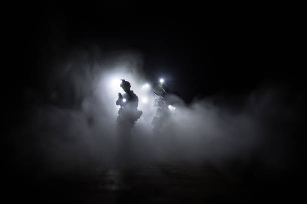 Anti-riot police give signal to be ready. Government power concept. Police in action. Smoke on a dark background with lights. Blue red flashing sirens. Dictatorship power stock photo