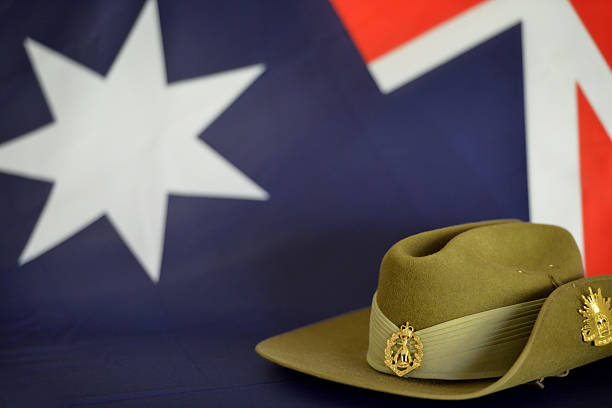 A slouch hat in front of an Australian flag representing Anzac Day