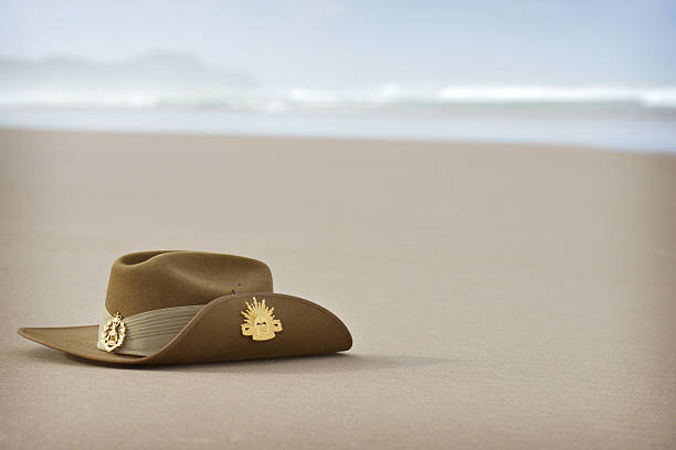 Anzac Day slouch hat on beach with copyspace A close up of an Australian army slouch hat sitting on the sand of a beach with plenty of copyspace for your words australian culture stock pictures, royalty-free photos & images