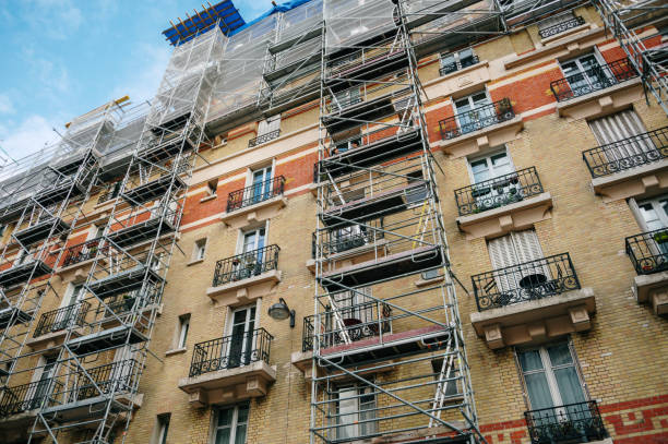 Apartment building facade with scaffolding stock photo