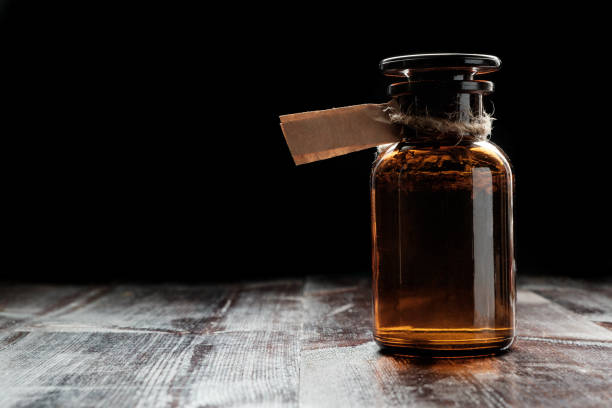 apothecary bottle with potion or tincture stock photo