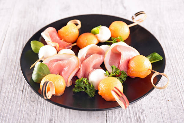 appetizer with melon, mozzarella and prosciutto ham appetizer with melon, mozzarella and prosciutto ham prosciutto stock pictures, royalty-free photos & images