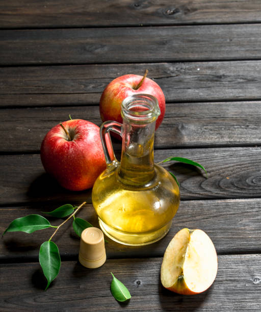 Apple cider vinegar with fresh apples. stock photo