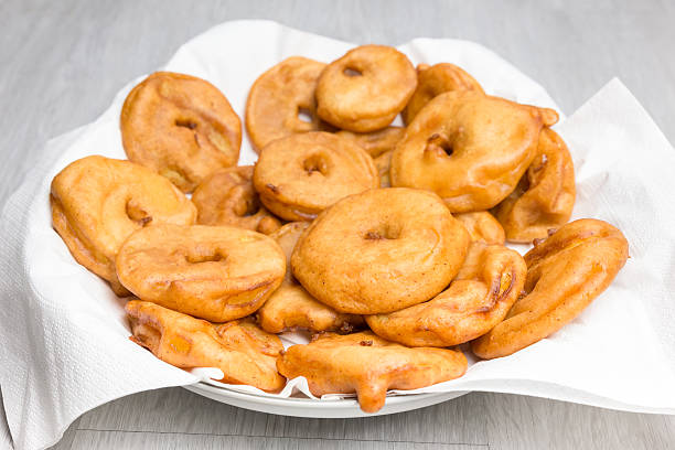 Apple fritters on napkins in scale stock photo