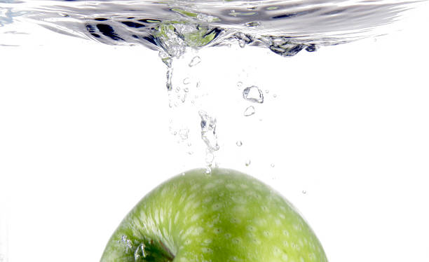 Apple in water stock photo