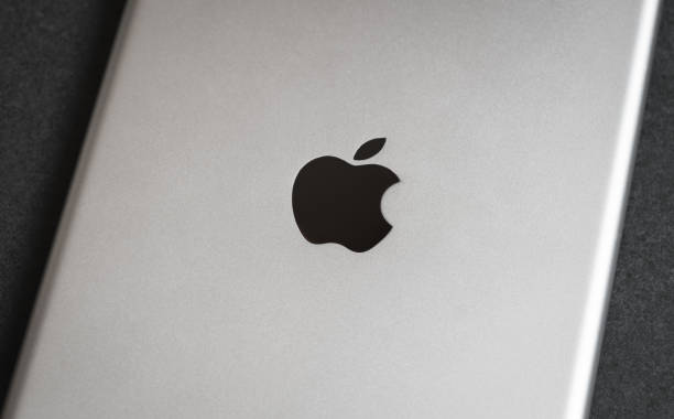 Apple iPad mini on dark backround, backside. stock photo