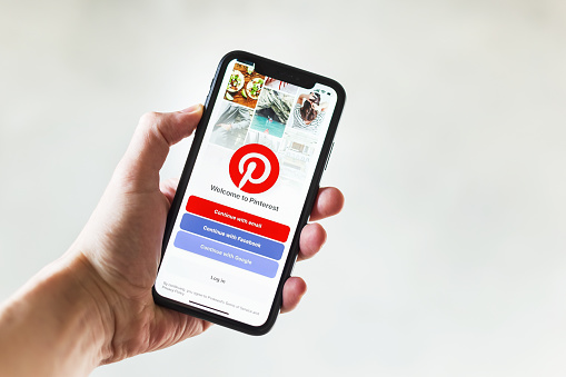 Tyumen, Russia - May 1,2019: Apple iPhone XR showing homepage Pinterest application on mobile