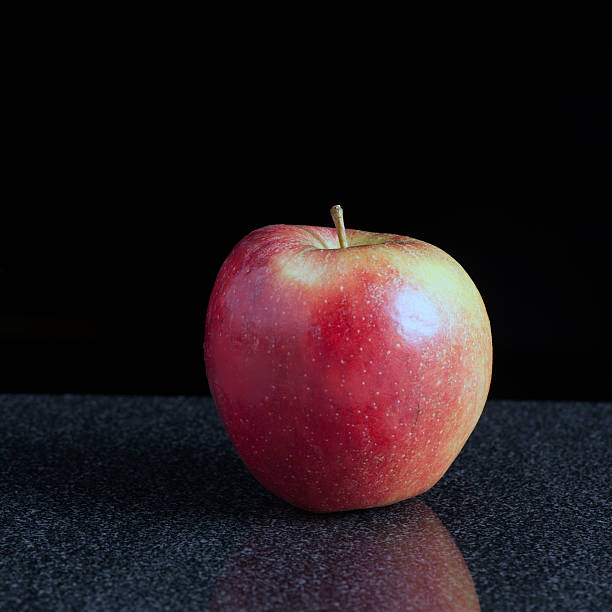 Apple on a Granite Surface stock photo
