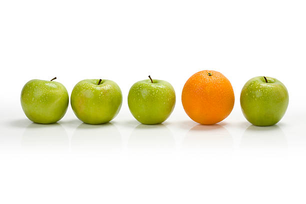 Apple row with orange stock photo