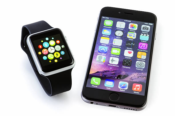Apple Watch Sport with iPhone 6s on white stock photo