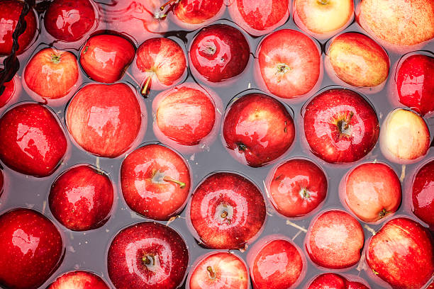 Apples in Water Apples in water, ready to be made in to cider cider stock pictures, royalty-free photos & images