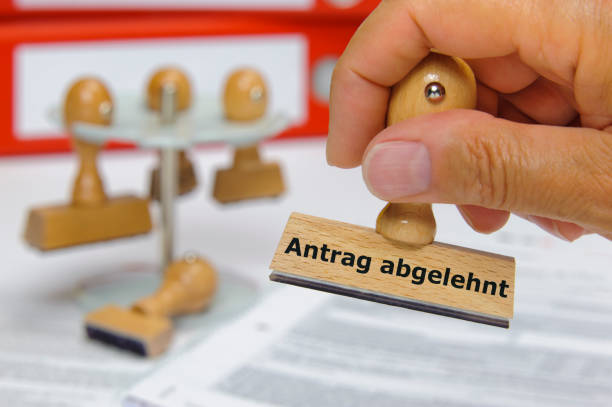 application rejected printed on rubber stamp - in German language; Antrag abgelehnt stock photo