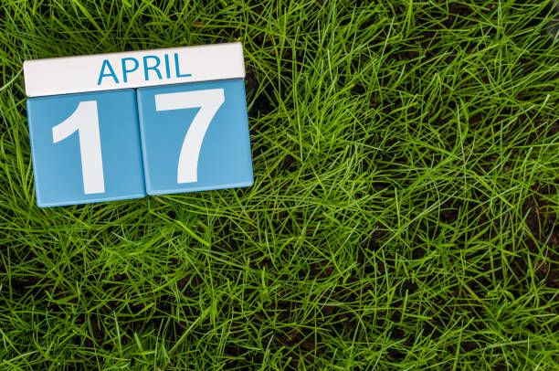 April 17th. Day 17 of month, calendar on football green grass background. Spring time, empty space for text April 17th. Day 17 of month, calendar on football green grass background. Spring time, empty space for text. march calendar 2017 stock pictures, royalty-free photos & images