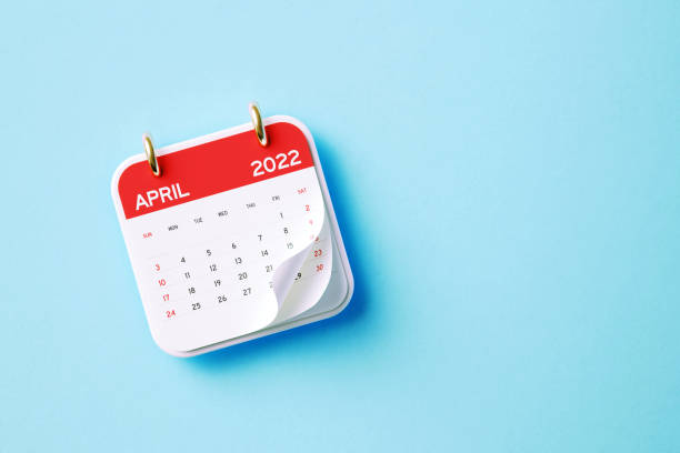 2022 April Calendar Aquamarine Background 2022 April calendar sitting on aquamarine background. Horizontal composition with copy space. Directly above. Calendar and reminder concept. april stock pictures, royalty-free photos & images