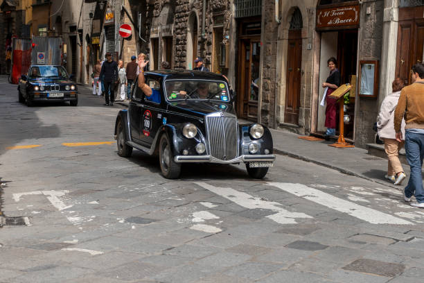 LANCIA Aprilia (1949) in the rally Mille Miglia 2010 edition on a busy street in Florence. stock photo