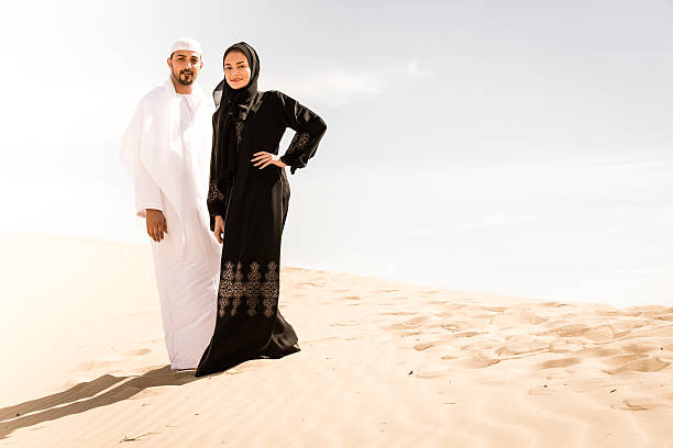 Arab Couple in the Desert An Arab Couple in Al Faqa'a Desert, Al Ain/Abu Dhabi, UAE hot middle eastern women stock pictures, royalty-free photos & images