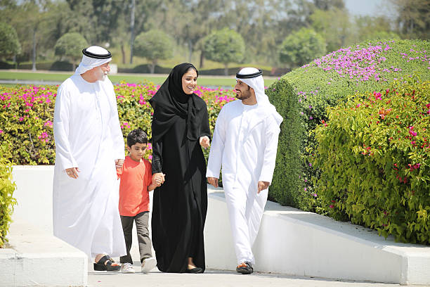 Arab family enjoying their leisure time in park Arab family enjoying their leisure time in park old arab man stock pictures, royalty-free photos & images
