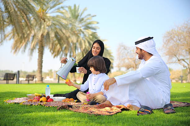 Arab family on picnic outdoors stock photo