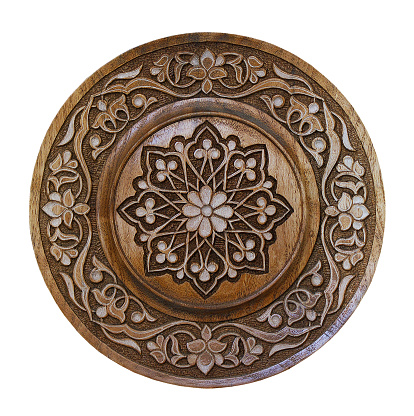 Arabic carved ornament on wooden plate, patterns. Souvenir plate.