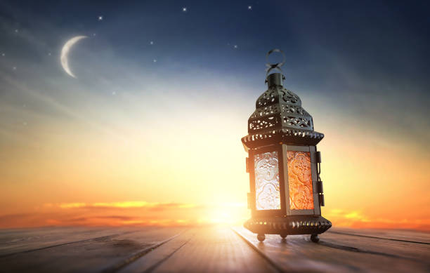 Arabic lantern with burning candle stock photo