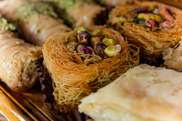 Arabic sweet dessert delights with pistachio stock photo