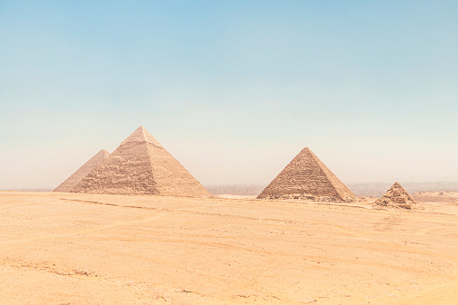 Archaeological complex of the Great Egyptian Pyramids is located on the Giza plateau. Pyramids of Chephren Khafra and Cheops Khufu and Mikerina Menkaura and the satellite pyramids. Cairo, Egypt.