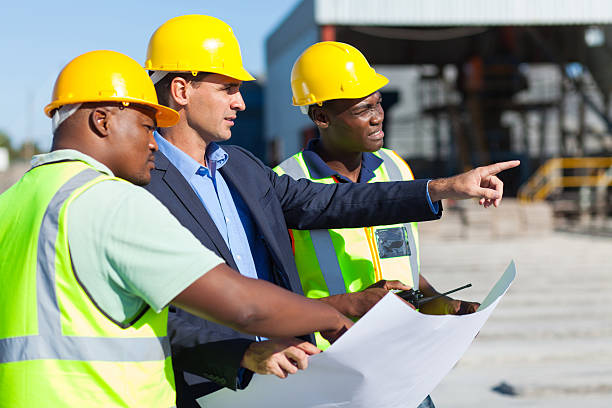 architect and construction workers stock photo
