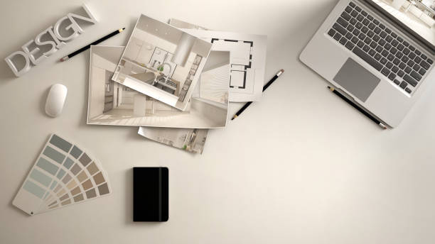 Architect designer concept, white work desk with computer, paper draft, kitchen project images and blueprint. Sample color material palette, creative background idea with copy space stock photo
