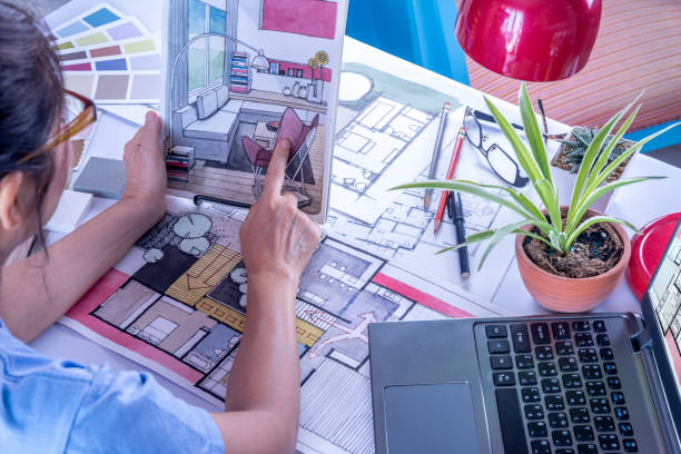 Architect, interior designer (creative) working at table in office stock photo
