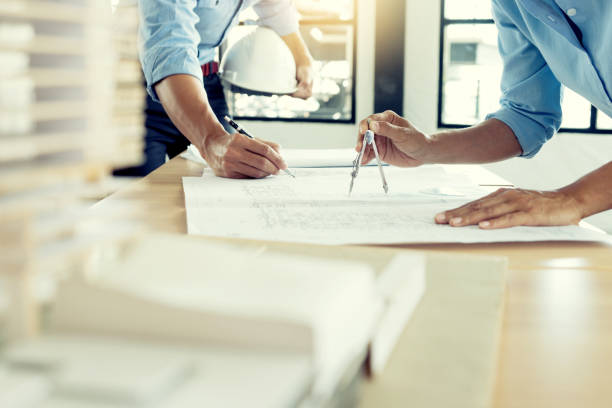 architect or engineer working on table show work stock photo