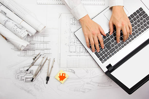 Architect working on blueprint. Architects workplace - architectural project, blueprints stock photo