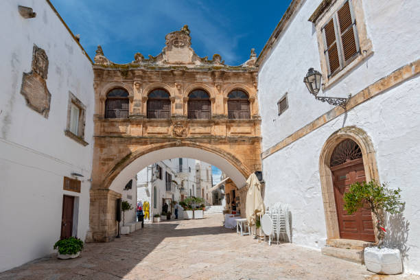 Arco Scoppa, bridge in front of the cathedral connecting the two buildings: the Palace of the Bishop and Palazzo del Seminalio, Puglia, Italy. stock photo