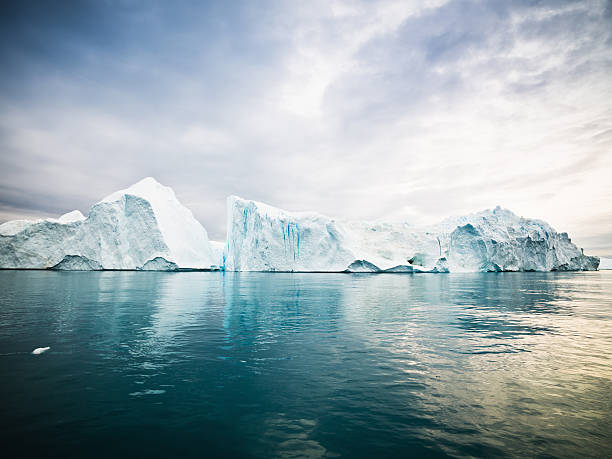 Arctic Icebergs Greenland North Pole Huge Icebergs drifting in polar arctic icefjord at the west greenland coast. Ilulissat Icefjord, Greenland, North West Coast. iceberg ice formation stock pictures, royalty-free photos & images